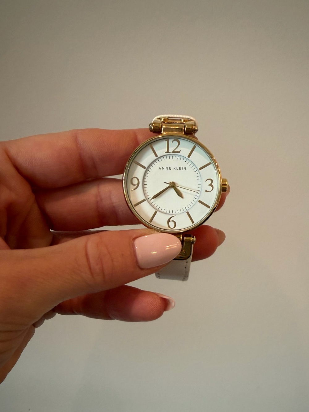 Anne Klein Gold-Tone Watch with White Face and Cream Strap
